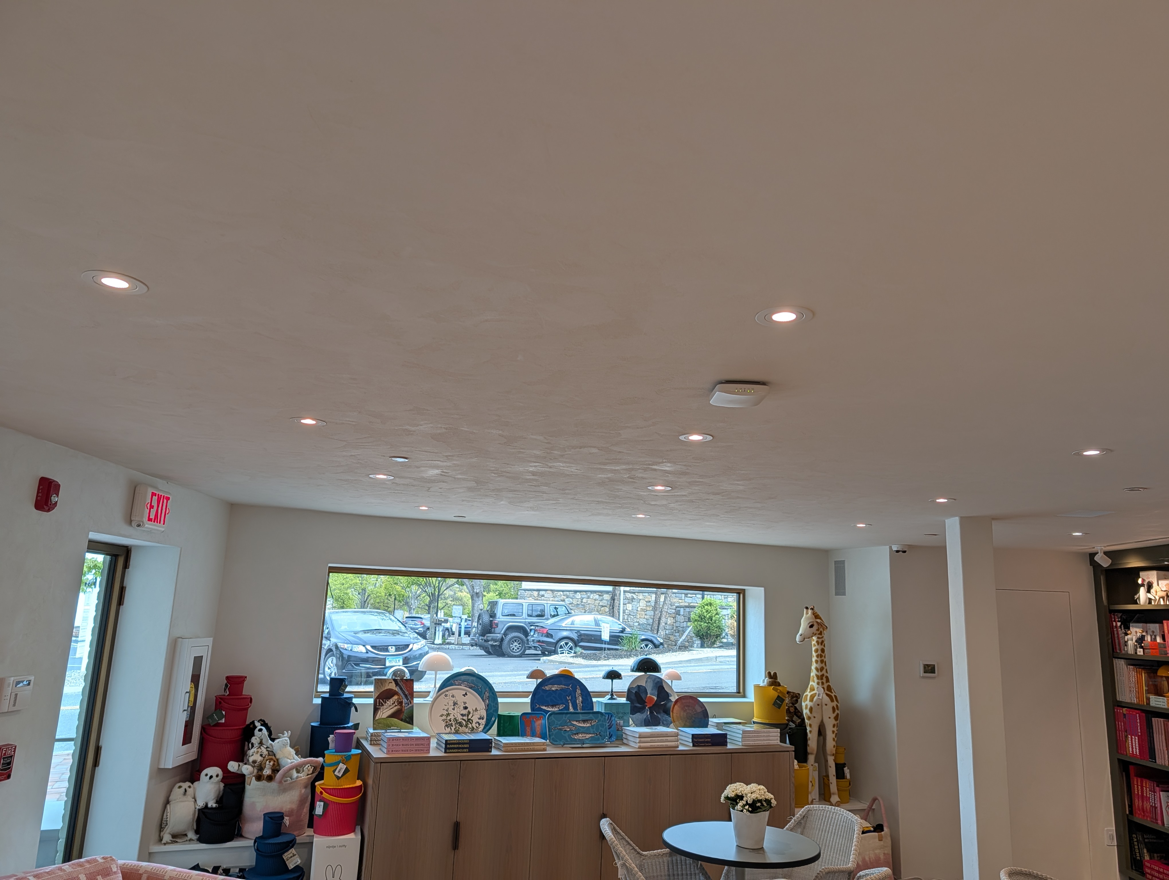 Recessed lighting installation in finished retail interior